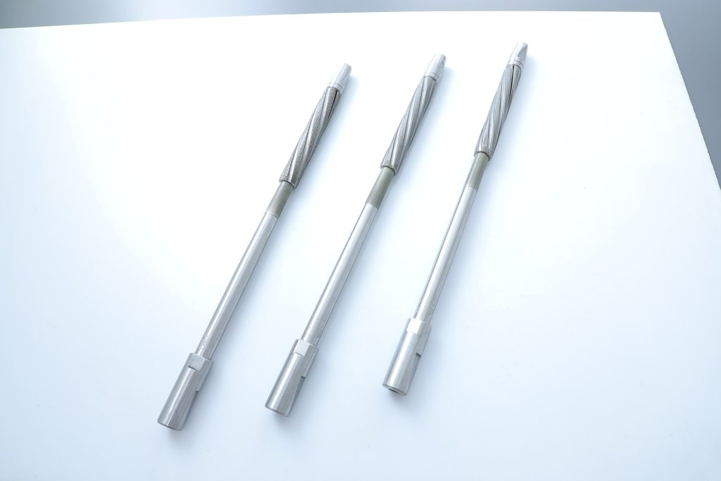 This image features three Single Pass Honing Tools for Step Bore, designed for achieving high-precision honing in components with multiple bore diameters. These tools ensure uniform material removal, superior surface finish, and tight tolerances in industries like automotive, aerospace, and hydraulics. Their diamond or CBN abrasive coating allows for efficient and consistent performance.