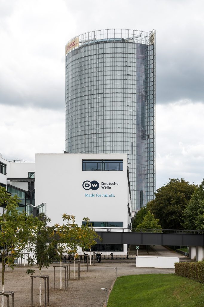 Tower “Post” and Deutsche Welle, Bonn, North Rhine-Westphalia, GermanyThe Post Tower is the tallest building in Bonn and a landmark of the modern federal district. After the parliament and government moved to Berlin, Bonn developed into the headquarters of international organizations and large companies.At the end of the 1990s, Deutsche Post DHL Group decided to establish its corporate headquarters here. Construction began in 2000 based on plans by architect Helmut Jahn. The glass tower, which is approximately 162 meters high, was completed in 2002. Its striking double facade and transparent architecture are intended to symbolize openness and internationality.The Post Tower represents Bonn’s economic transformation from the former federal capital to an important service and UN location.