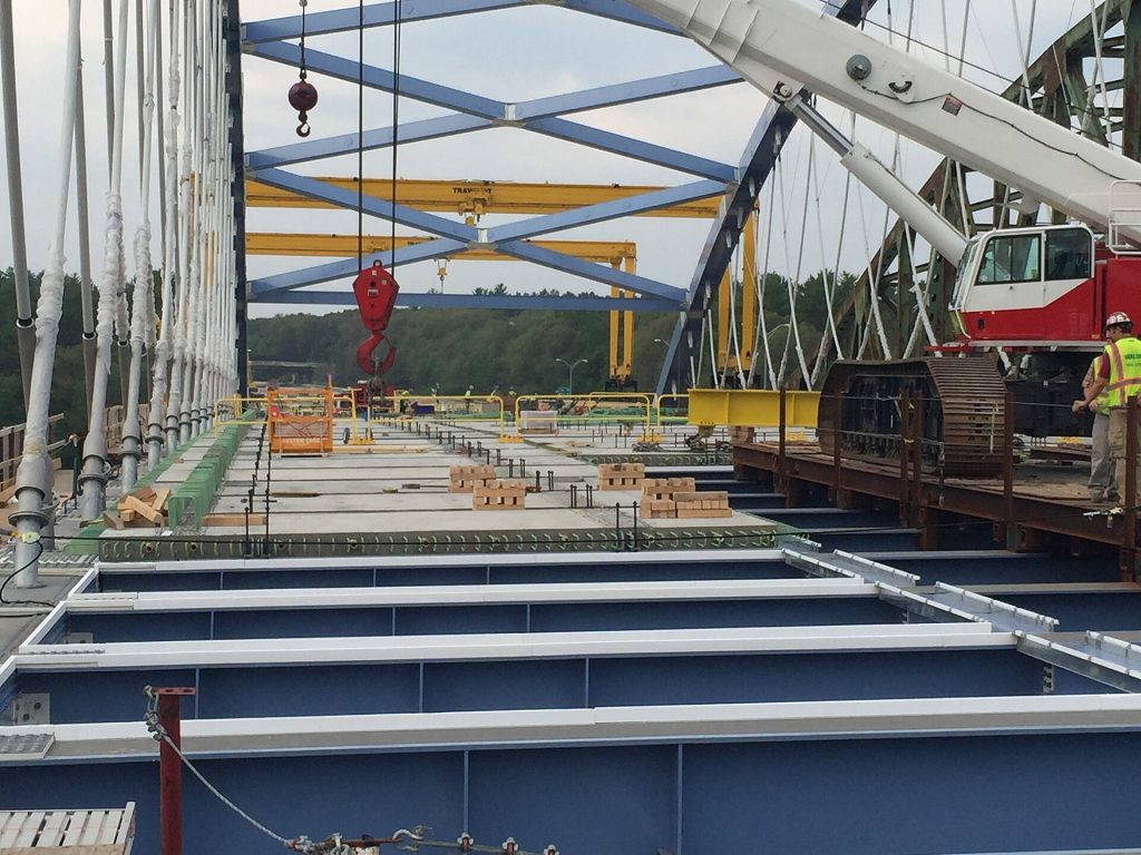 Concrete panels are installed to create the bridge deck at Spans 1 and 2 on the arch span.