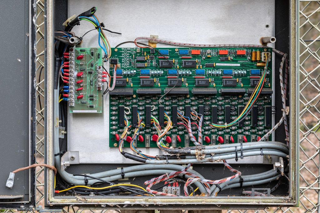 Electronics in a electrical enclosure at the Dülmen-Visbeck Special Ammunition Storage, Dernekamp, Kirchspiel, Dülmen, North Rhine-Westphalia, GermanyThe Bundeswehr Ammunition Depot, located approximately 4.5 km south of Dülmen, was built between 1963 and 1965 as part of the St. Barbara Barracks in Dülmen. The special ammunition storage (SAS) within the ammunition depot was put into operation by the US Army in 1969. Over time, and particularly in the 1980s, the special ammunition storage in particular was made significantly more secure. The special ammunition storage was abandoned in the early 1990s, as was the ammunition depot in 1996. It passed into private hands. The town of Dülmen acquired the site in 2017 and it has been open to visitors on guided tours since 2019.