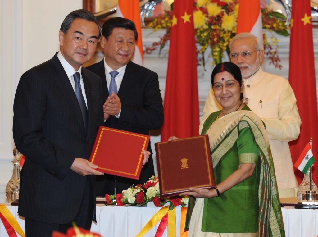 In New Delhi on September 18, 2014, the Prime Minister, Narendra Modi and the Chinese President, Xi Jinping witnessing the signing of an memorandum of understanding between their foreign ministers Sushma Swaraj and Wang Yi. This memorandum opens an alternative Hindu pilgrimage (yatra) route, named "Kailash-Mansarovar yatra". While both Mount Kailash (冈仁波齐峰) and Lake Mansarovar (玛旁雍錯) are situated in Tibet Autonomous Region of the PRC, the only route as of 2014 goes via the Lipulekh Pass (里普列克山口). A new route that goes through Nathu La (乃堆拉山口) was opened in 2015 as a result of this memorandum. For news coverage before and after the memorandum, see: "China poised to open a new route to Kailash-Mansarovar yatr". IndiaWrites.org. 2014-09-04. Retrieved 2020-08-28. {{cite news}}: Cite has empty unknown parameter: |7= (help)CS1 maint: deprecated archival service (link) "Kailash Mansarovar Yatra through both Nathu La, Lipulekh Pass routes opened after Sino-Indian understanding". The Economic Times, India. 2018-02-22. Retrieved 2020-08-28. {{cite news}}: Cite has empty unknown parameter: |7= (help)CS1 maint: deprecated archival service (link)