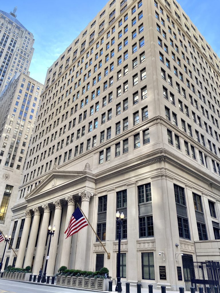 Federal Reserve Bank of Chicago as seen from LaSalle Street. The Chicago Board of Trade is partly visible in the background.