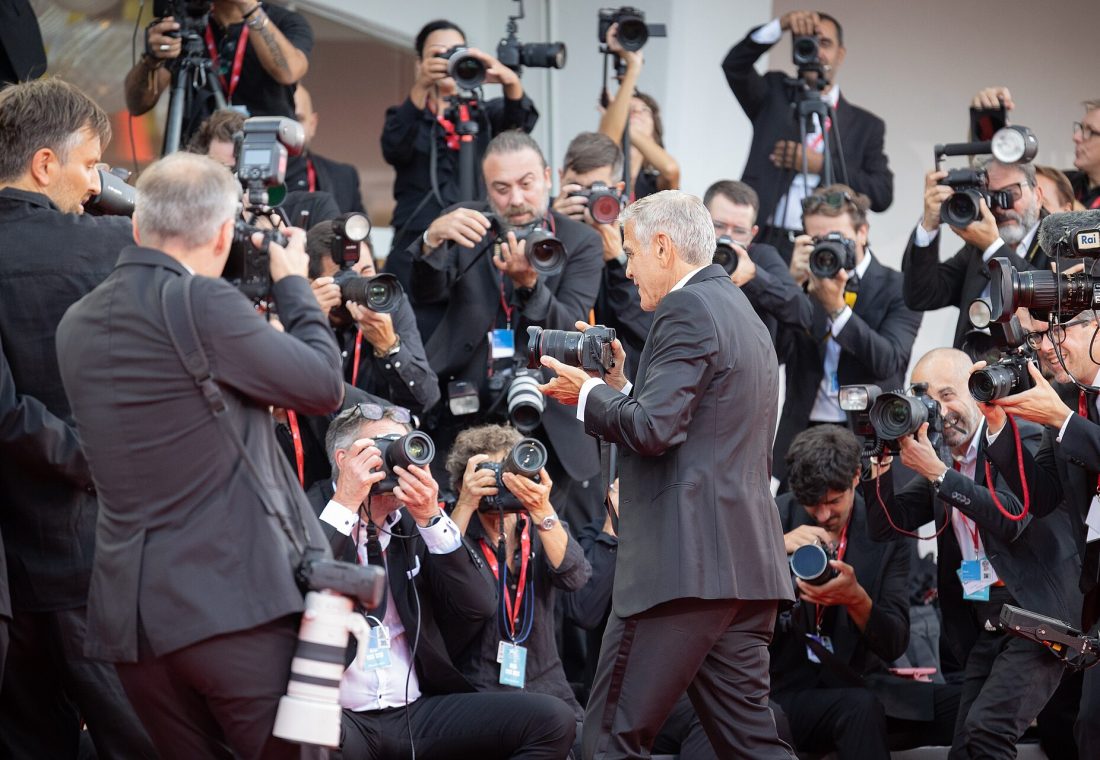 George clooney and photographers on the red carpet in Venice Film Festival -34