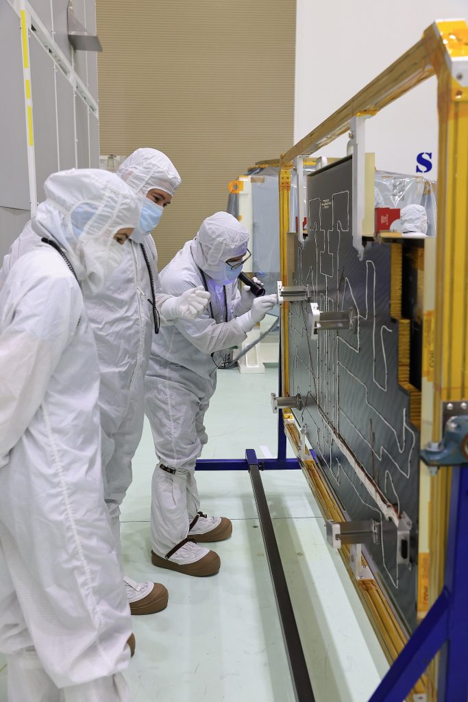 Technicians at the Astrotech Space Operations Facility near NASA’s Kennedy Space Center in Florida install the two-panel solar array on Thursday, July 17, 2025, that will help power the agency’s IMAP (Interstellar Mapping and Acceleration Probe) observatory on its upcoming journey one million miles away from Earth. Each panel of the solar array, located on the top of IMAP, consists of 16 strings of solar cells, with 36 cells per string, and combined will convert sunlight into 500 watts of power, more than enough for the observatory, which as a system uses less power than five 100-watt incandescent light bulbs.