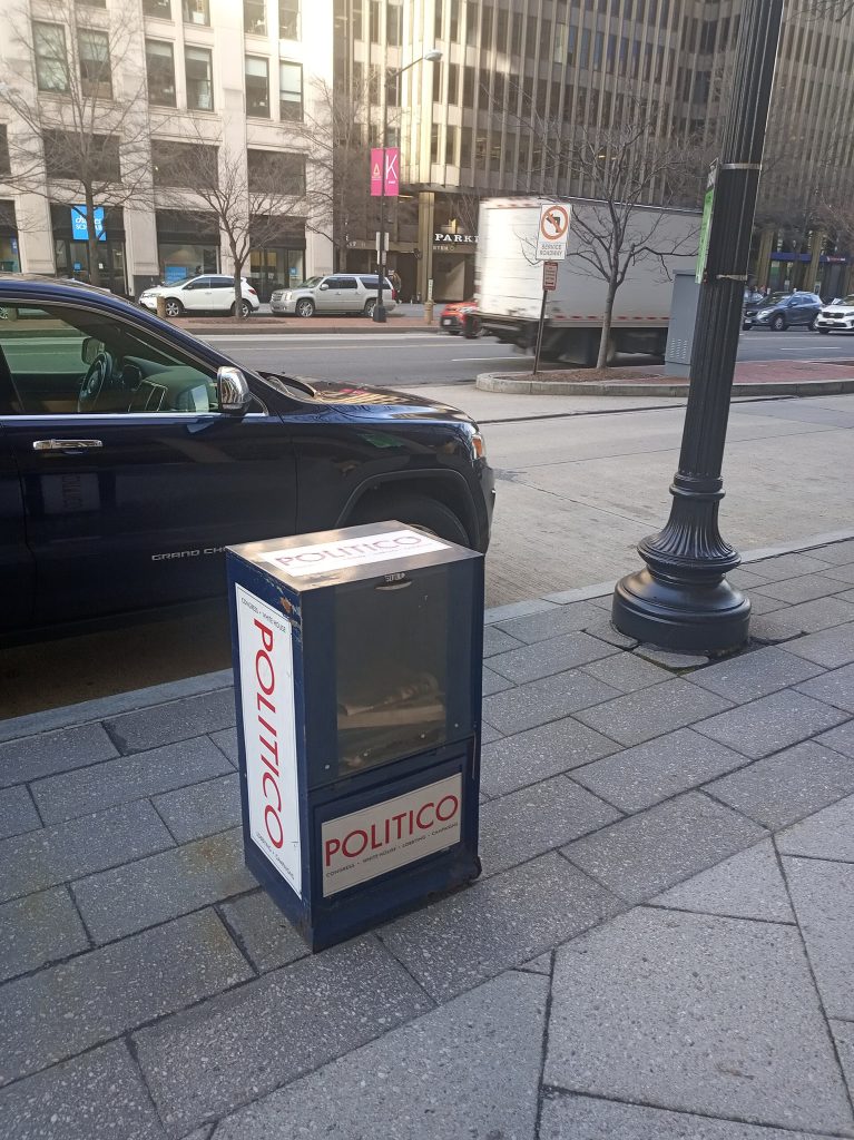 Vending box in the Golden Triangle neighborhood of Washington DC where passersby may acquire a free printout of a political blog called Politico.