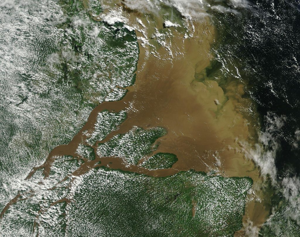 This stunning true-color image of the Amazon River Delta was acquired by the Moderate Resolution Imaging Spectroradiometer (MODIS) on NASA’s Terra satellite on May 13, 2025. The Amazon River Delta is formed by the joining of the Amazon River and the Tocantins River (through the Pará River distributary channel) and is located in the Brazilian states of Pará and Amapá. The Amazon River rises in the foothills of the Andes Mountains, more than 3,900 miles (6,300 kilometers) away. As the river courses across South America, it erodes river banks and accepts sediment, rocks, and other debris as runoff, then carries it along. Some of the sediment may be deposited where the Amazon River slows or turns, but most of the sediment burden ends up discharged into the Atlantic Ocean, as can be seen in this image.