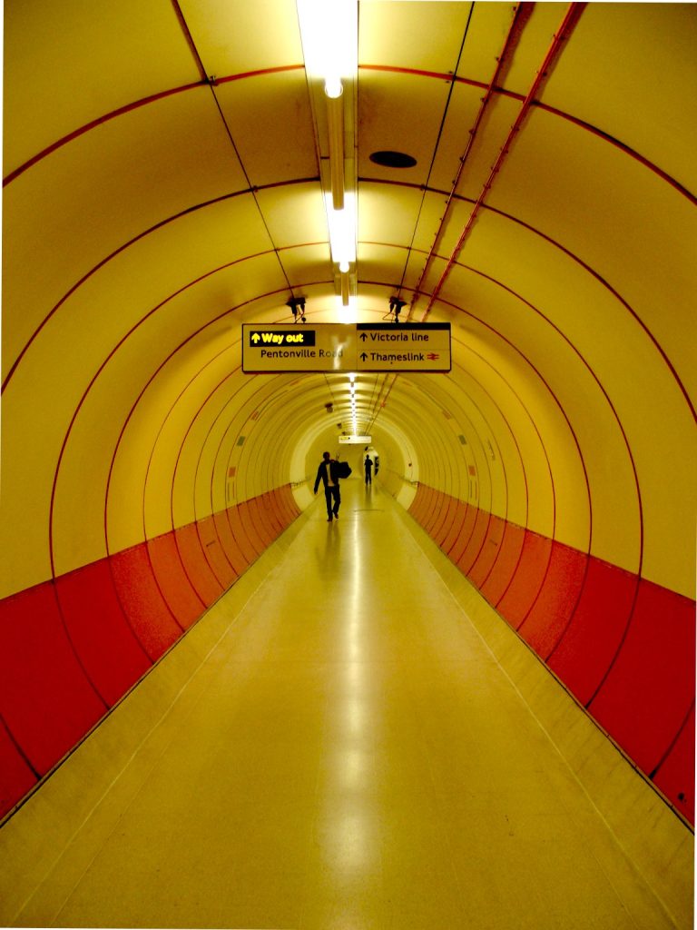 A tunnel leading to the Thameslink service at Kings Cross underground station. Edited version (denoised, lighter) of Image:Kings cross tunnel.jpg.